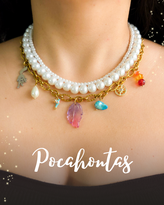Close-up of a Pocahontas-inspired layered necklace featuring glass pearls, gold chain, and themed charms including a raccoon, bird, feather, compass, and gemstone drops.